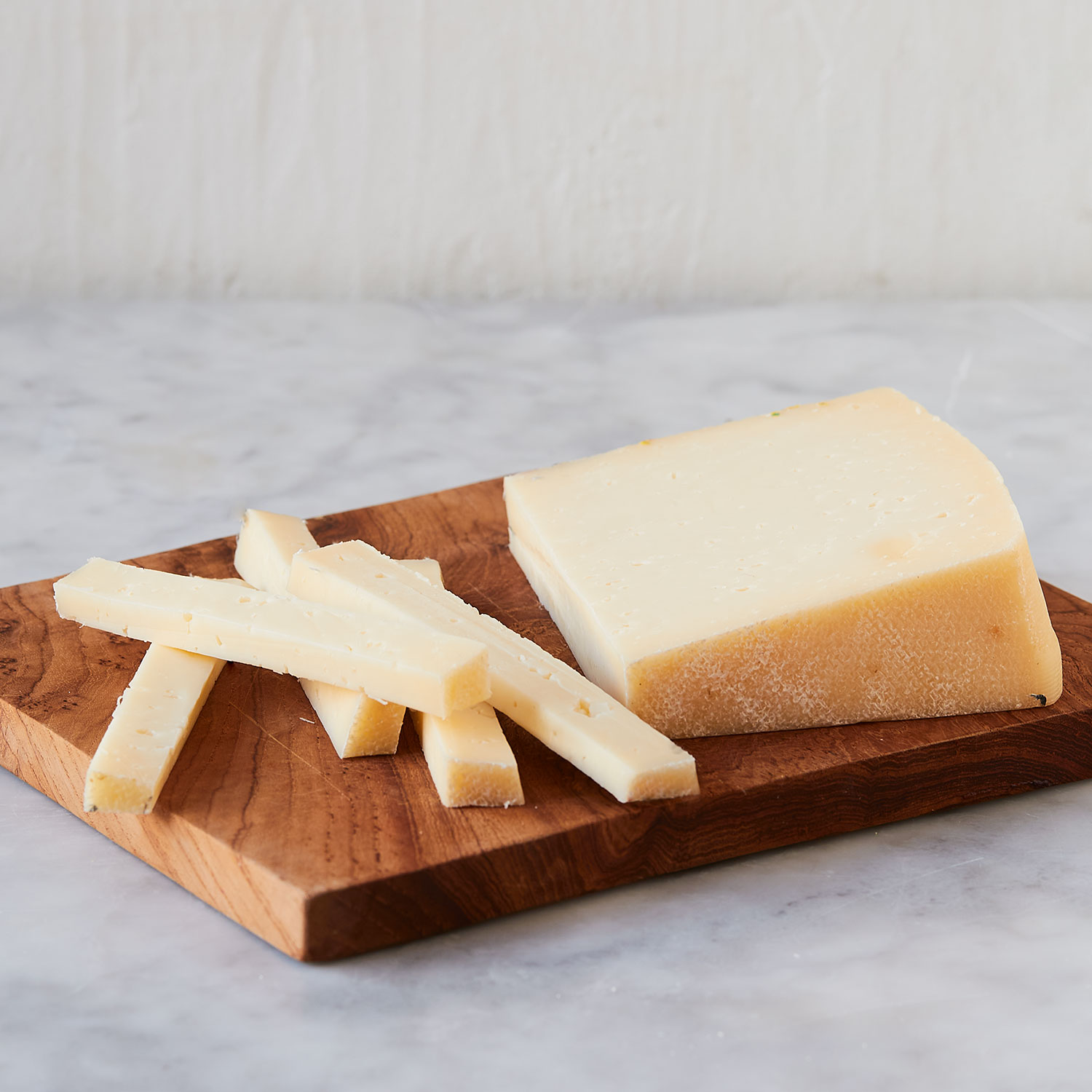 Asiago Pressato a mild, sweet, buttery Italian cow’s milk cheese