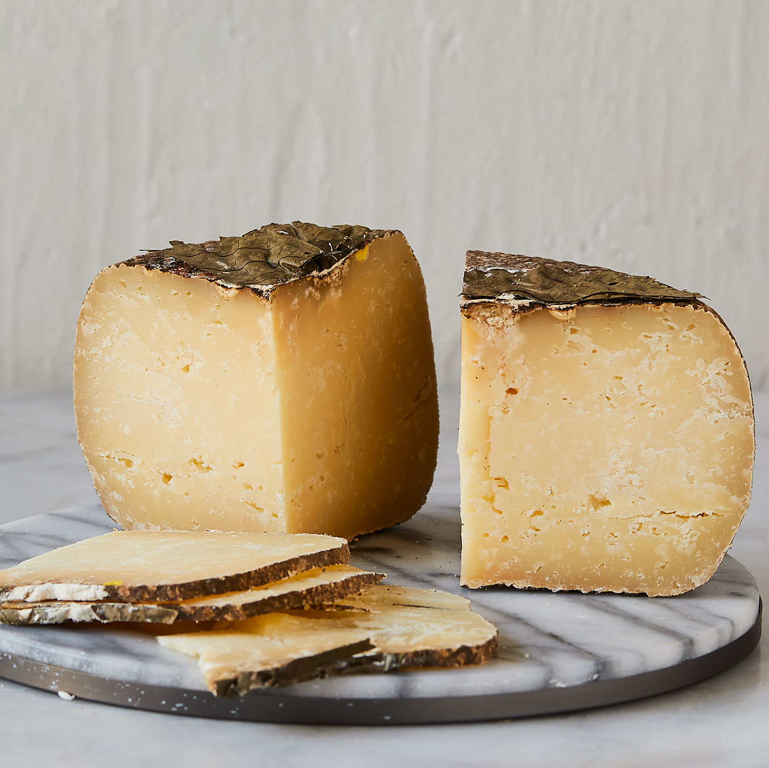 Pecorino Foglie di Noce a firm, earthy Italian cheese covered in