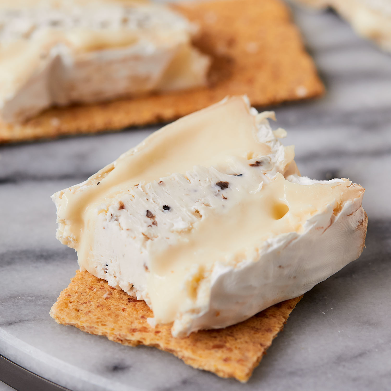 Truffle Brie Brie with mascarpone and black truffles Murray's Cheese